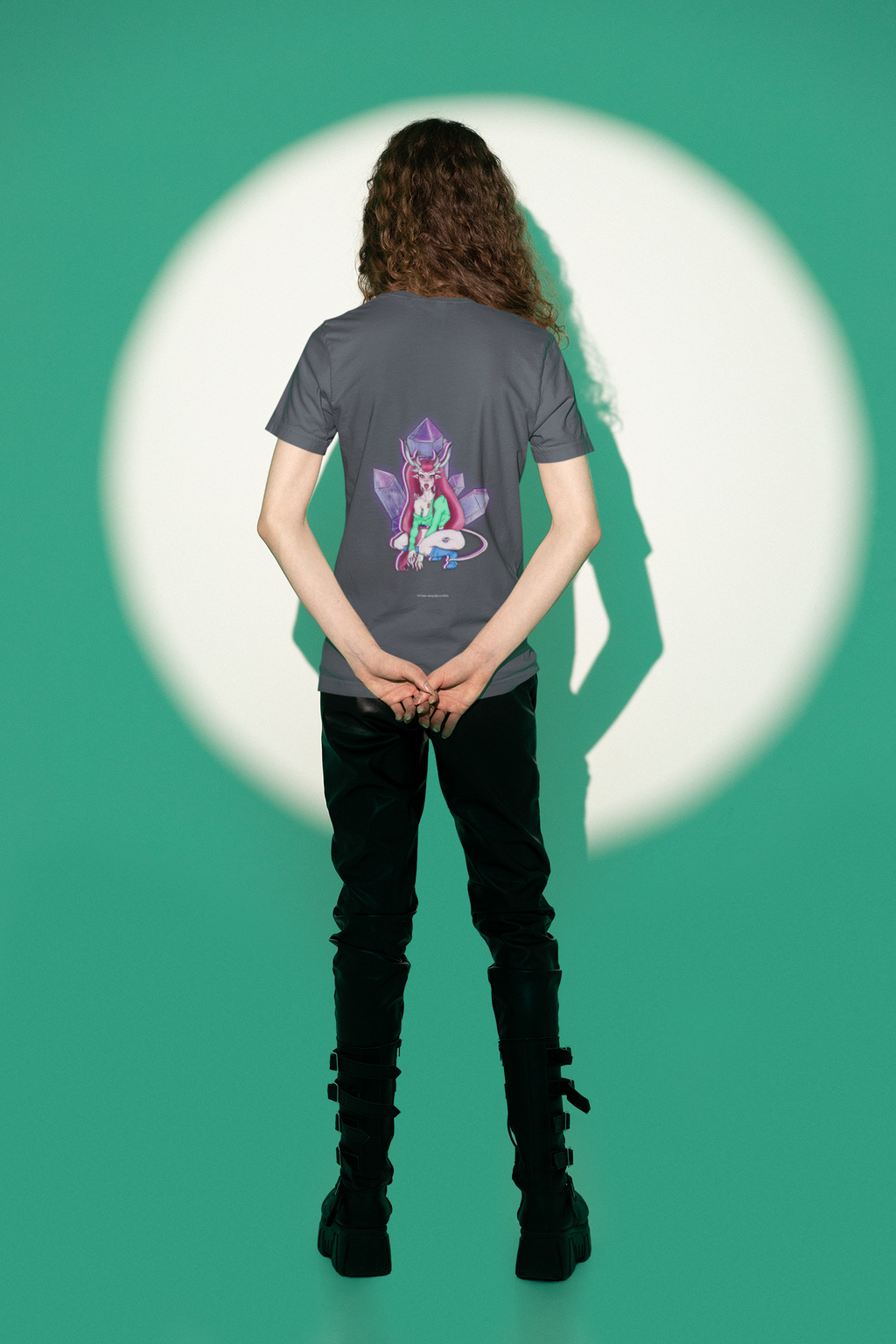 Heart Thief Garment-Dyed Tee in Navy, worn by a man seen from behind in a studio under green light, showing the large print on the back. Digital product mockup.