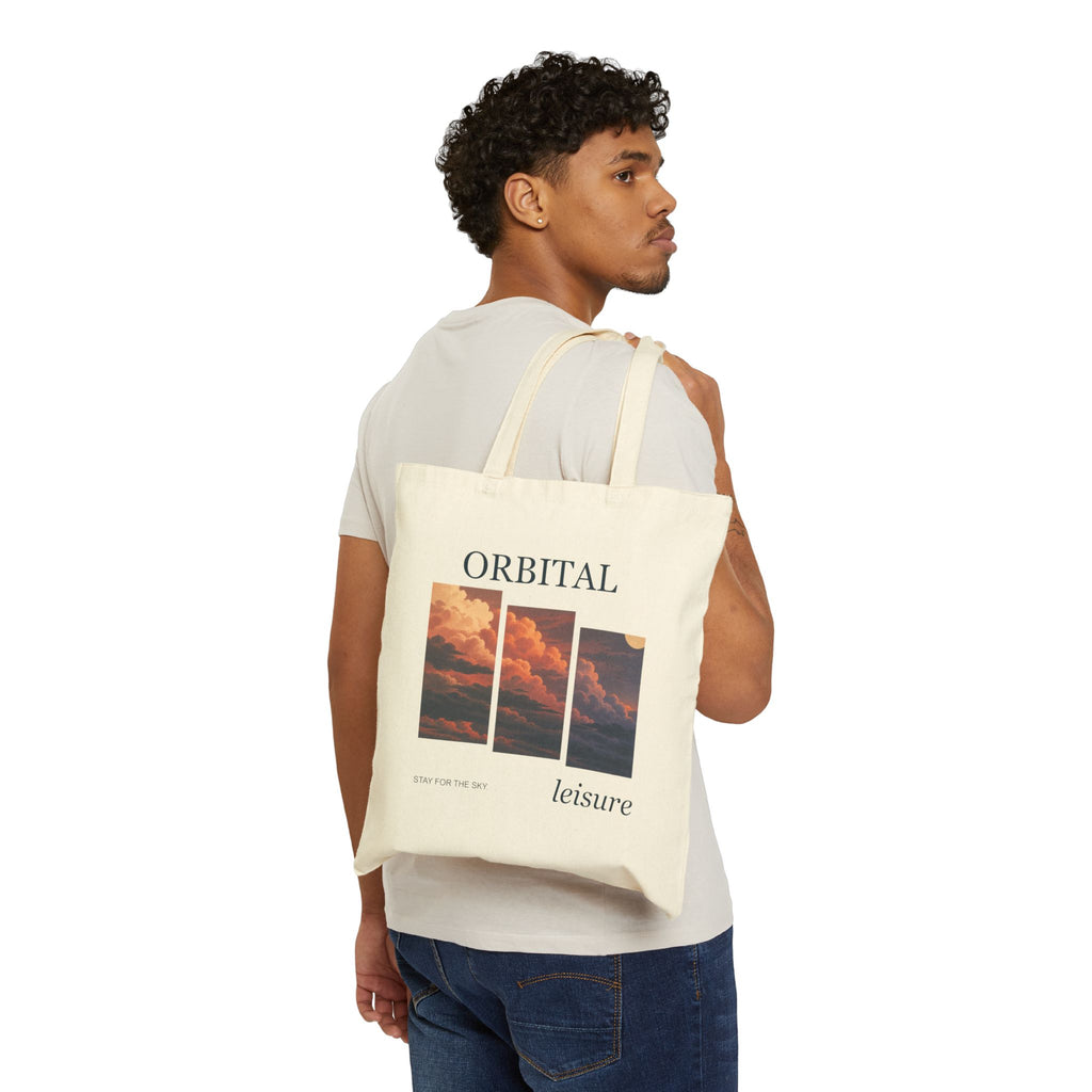 Stay for the Sky canvas tote carried on a shoulder, printed front facing outward. Digital product mockup.