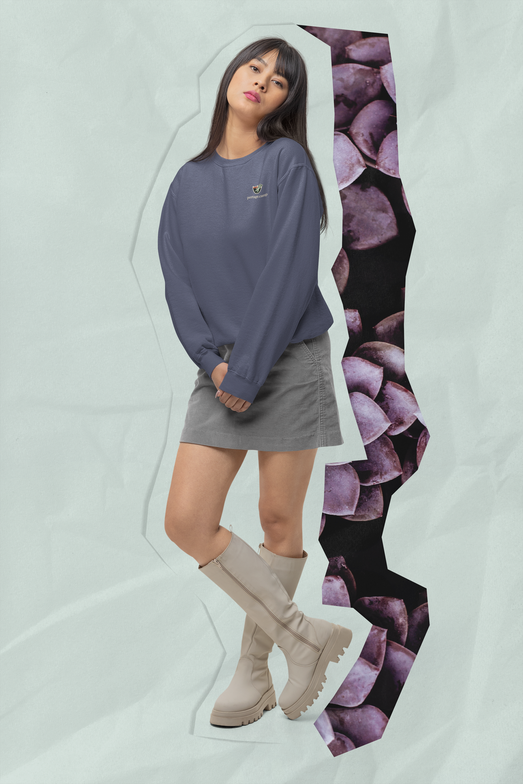 Seen Briefly Garment-Dyed Crewneck in Denim, worn by a woman in a studio, with the Seen Briefly logo and portage.camp on the chest. Digital product mockup.