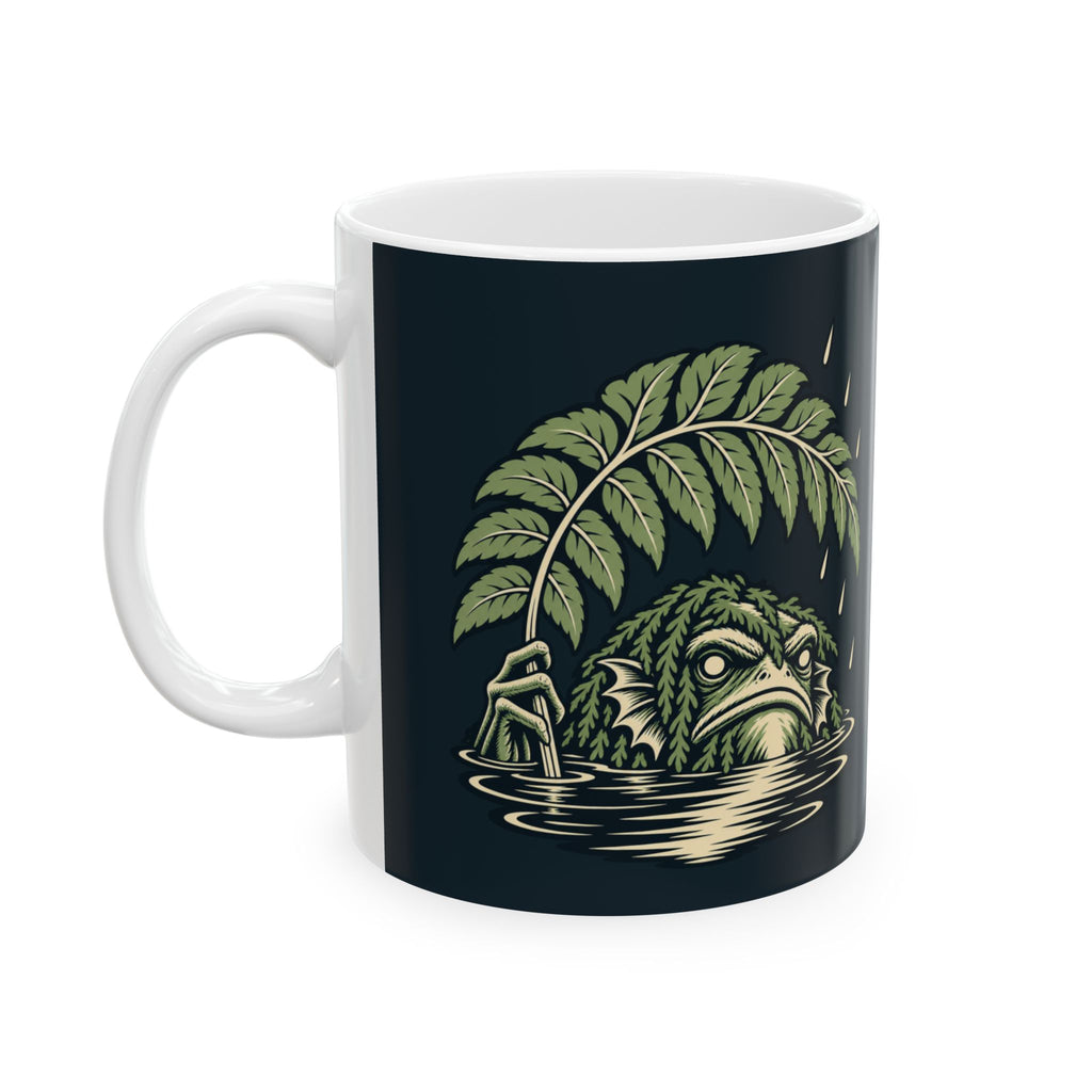 Rain Check Ceramic Mug, handle on the left, the swamp creature under the fern in the rain. Digital product mockup.