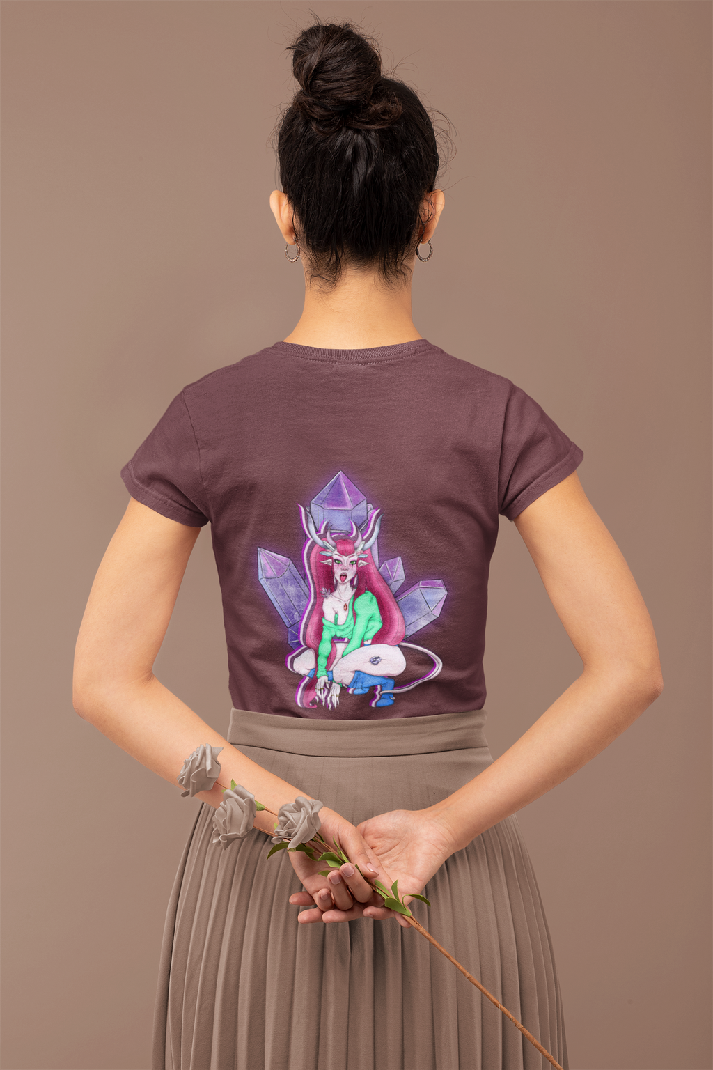 Heart Thief Women’s Relaxed Tee in Maroon, worn by a woman seen from behind holding flowers, showing the large print on the back. Digital product mockup.