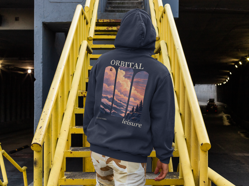 Cloud Ferry Zip Hoodie in Navy, worn by a man seen from behind climbing a yellow metal staircase, showing the large print on the back. Digital product mockup.
