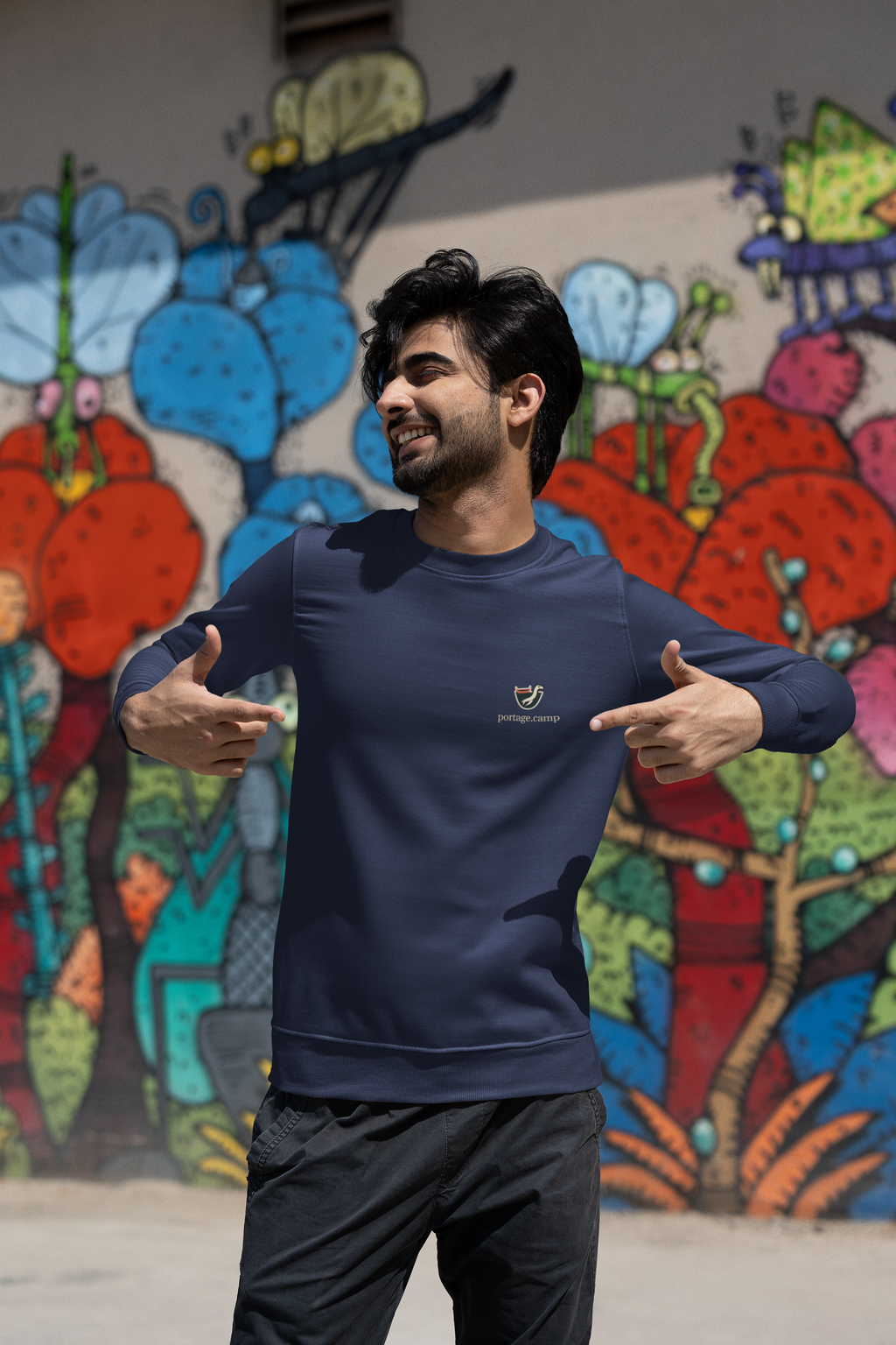 Seen Briefly Garment-Dyed Crewneck in True Navy, worn by a man on a city street, with the Seen Briefly logo and portage.camp on the chest. Digital product mockup.
