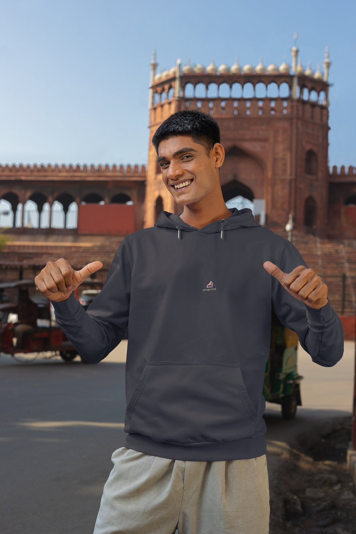 A Different Sky Midweight Hoodie in Classic Navy, worn by a man on a city street, with the A Different Sky logo and portage.camp on the chest. Digital product mockup.