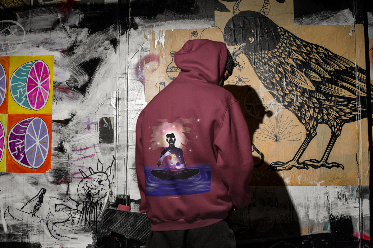 Orbit Keeper Midweight Hoodie in Maroon, worn by a man seen from behind in a dark alley, showing the large print on the back. Digital product mockup.