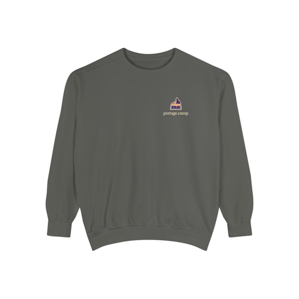 A Different Sky Garment-Dyed Crewneck in Pepper, front view with the A Different Sky logo and portage.camp on the chest. Digital product mockup.