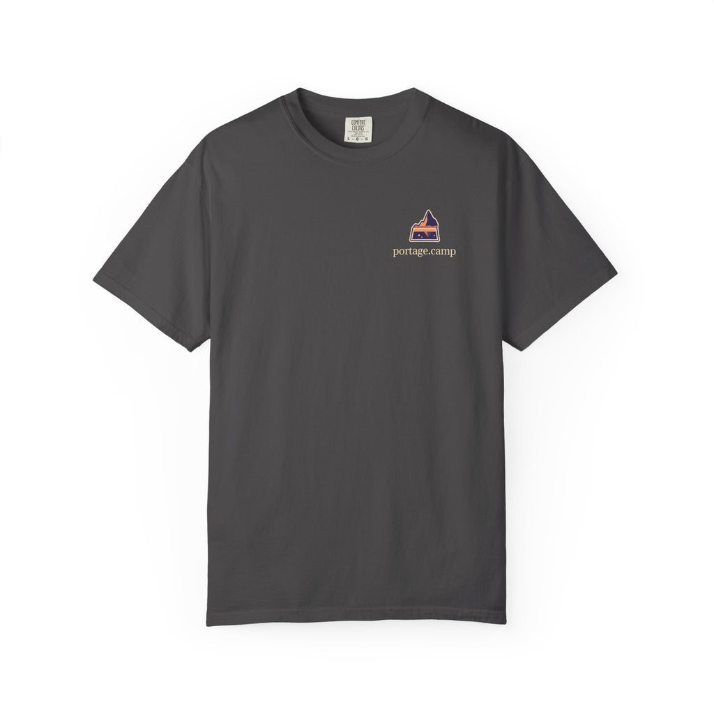 A Different Sky Garment-Dyed Tee in Graphite, front view with the A Different Sky logo and portage.camp on the chest. Digital product mockup.