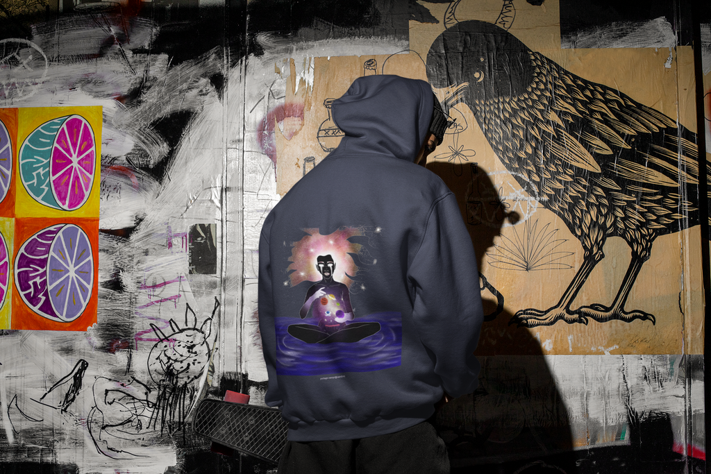 Orbit Keeper Midweight Hoodie in Classic Navy, worn by a man seen from behind in a dark alley, showing the large print on the back. Digital product mockup.