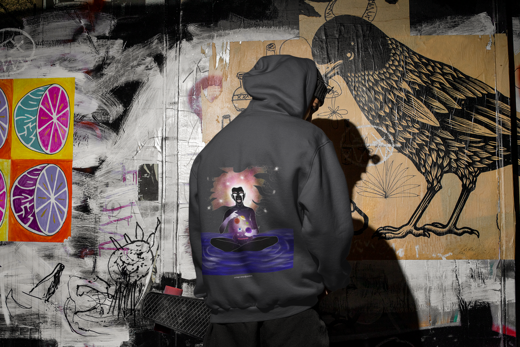 Orbit Keeper Heavyweight Hoodie in Black, worn by a man seen from behind in a dark alley, showing the large print on the back. Digital product mockup.