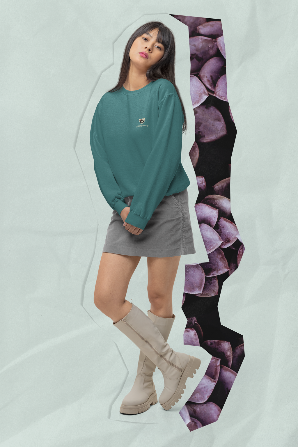 Seen Briefly Garment-Dyed Crewneck in Blue Spruce, worn by a woman in a studio, with the Seen Briefly logo and portage.camp on the chest. Digital product mockup.