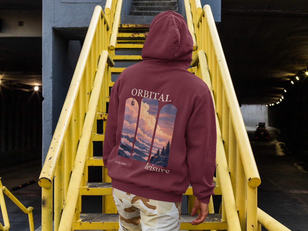 Cloud Ferry Midweight Hoodie in Maroon, worn by a man seen from behind climbing a yellow metal staircase, showing the large print on the back. Digital product mockup.