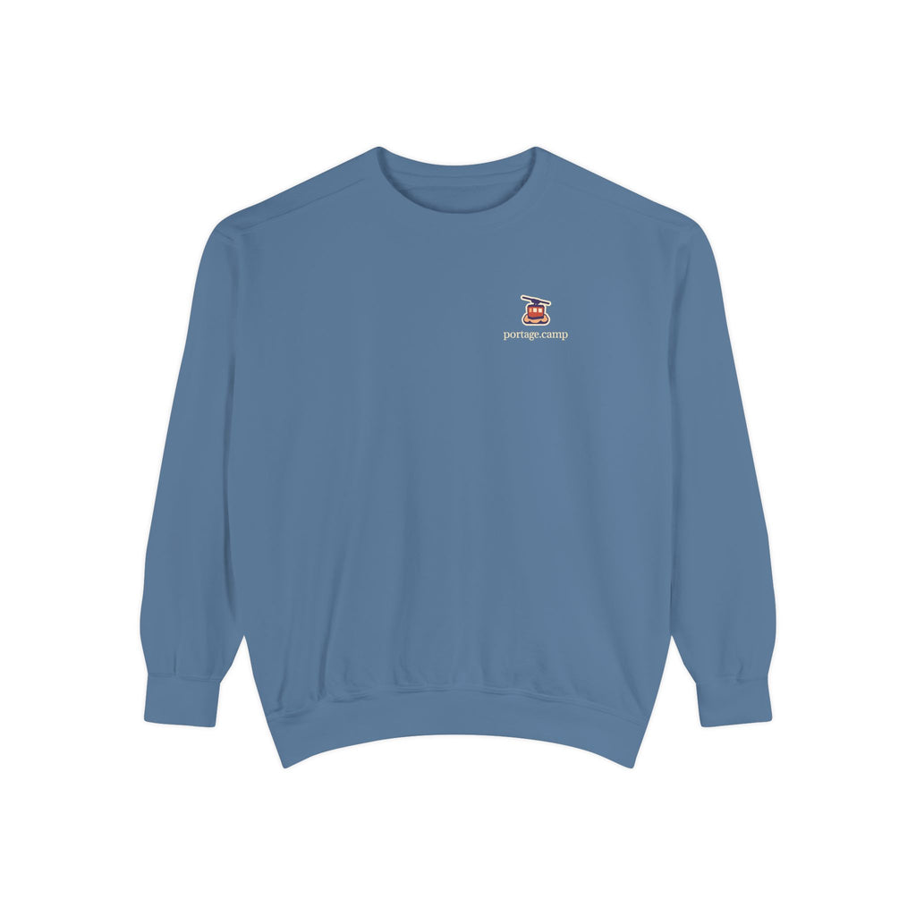 Cloud Ferry Garment-Dyed Crewneck in Blue Jean, front view with the Cloud Ferry logo and portage.camp on the chest. Digital product mockup.