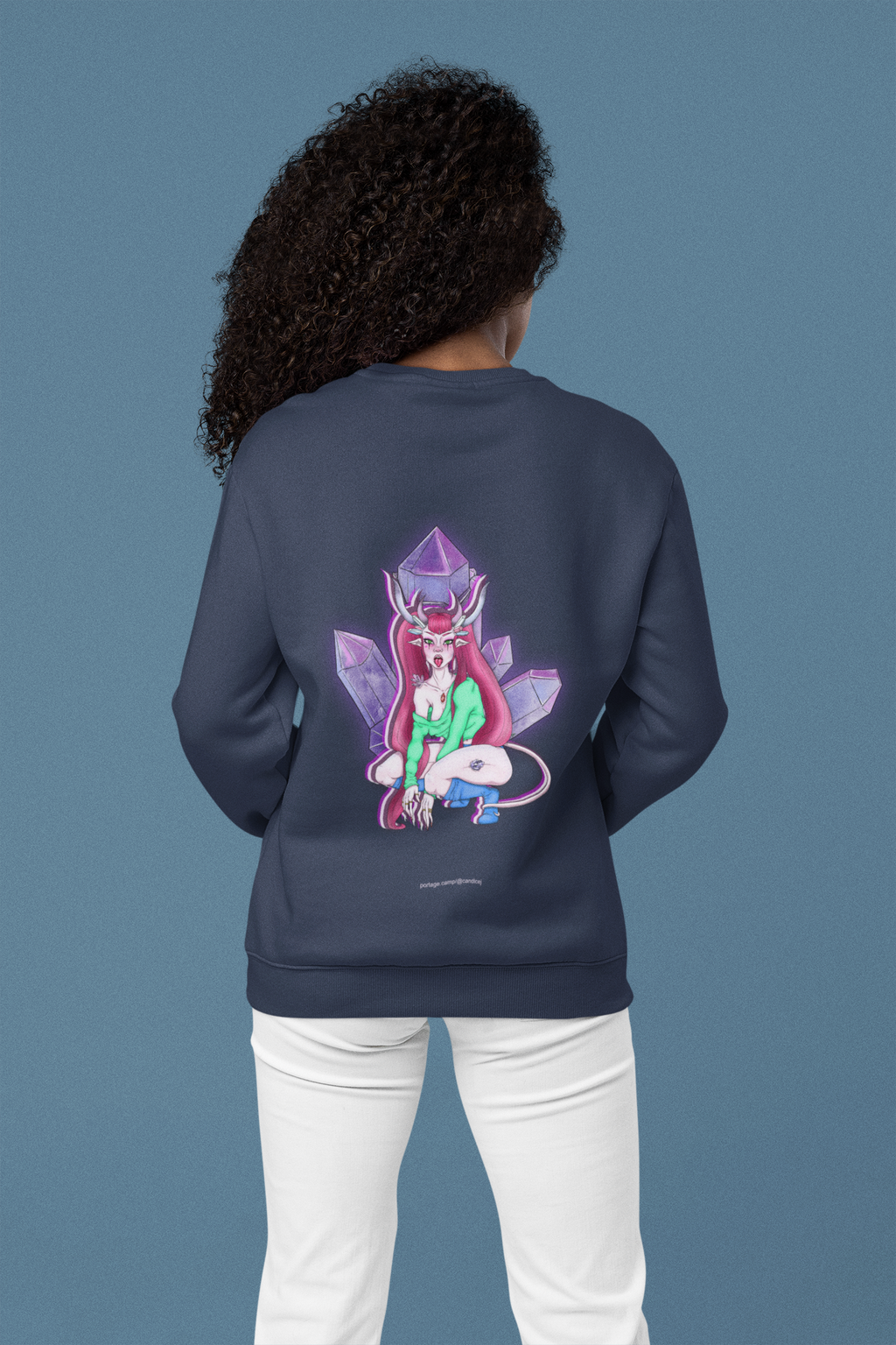 Heart Thief Garment-Dyed Crewneck in True Navy, worn by a woman seen from behind in a studio, showing the large print on the back. Digital product mockup.