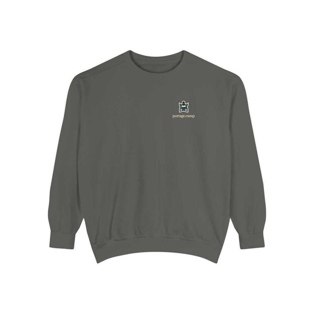 Night Library Garment-Dyed Crewneck in Pepper, front view with the Night Library logo and portage.camp on the chest. Digital product mockup.