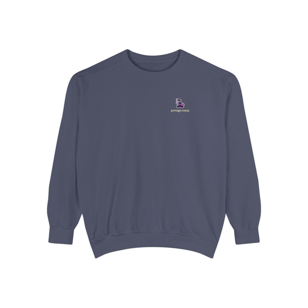 Orbit Keeper Garment-Dyed Crewneck in Denim, front view with the Orbit Keeper logo and portage.camp on the chest. Digital product mockup.