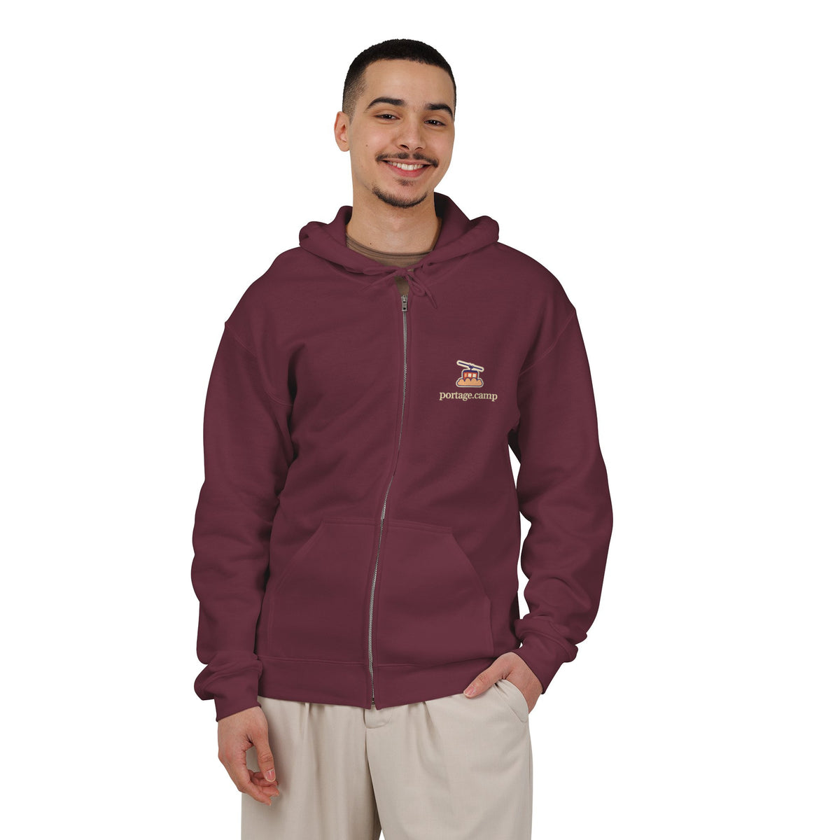 Cloud Ferry Zip Hoodie in Maroon, worn by a man in a plain white studio, with the Cloud Ferry logo and portage.camp on the left chest. Digital product mockup.
