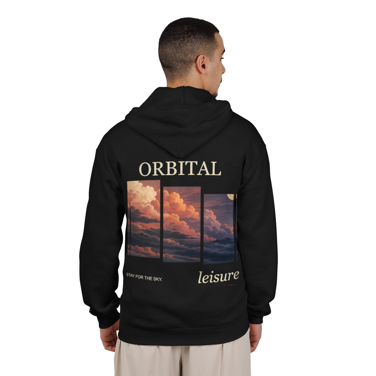 Stay for the Sky Zip Hoodie in Black, worn by a man seen from behind in a plain white studio, showing the large print on the back. Digital product mockup.