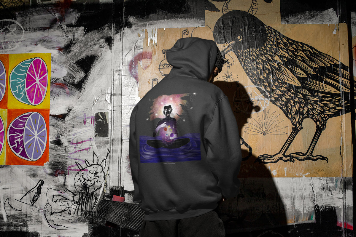 Orbit Keeper Zip Hoodie in Black, worn by a man seen from behind in a dark alley, showing the large print on the back. Digital product mockup.
