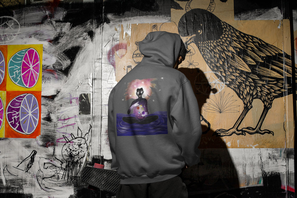 Orbit Keeper Zip Hoodie in Dark Heather, worn by a man seen from behind in a dark alley, showing the large print on the back. Digital product mockup.