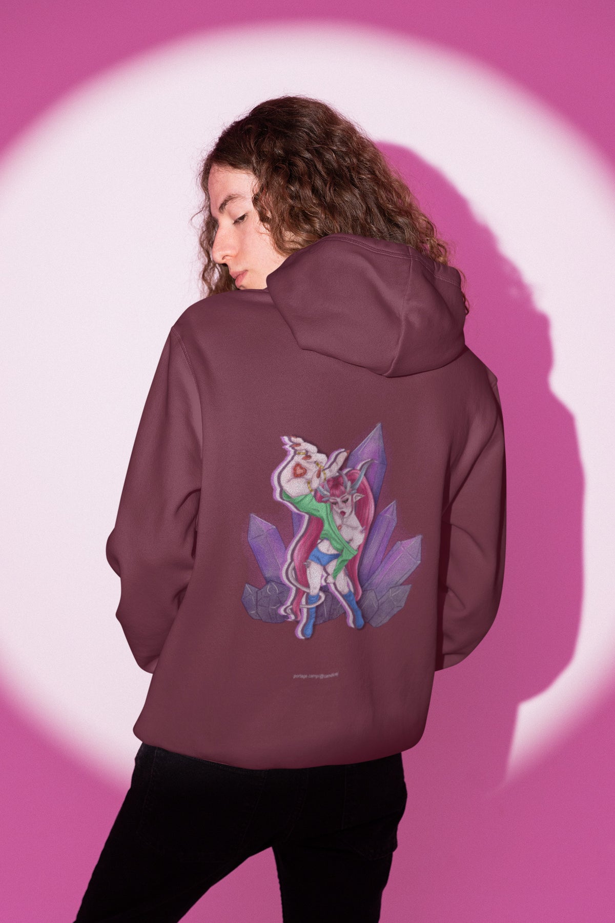 Heart Thief Zip Hoodie in Maroon, worn by a man seen from behind in a studio under pink light, showing the large print on the back. Digital product mockup.