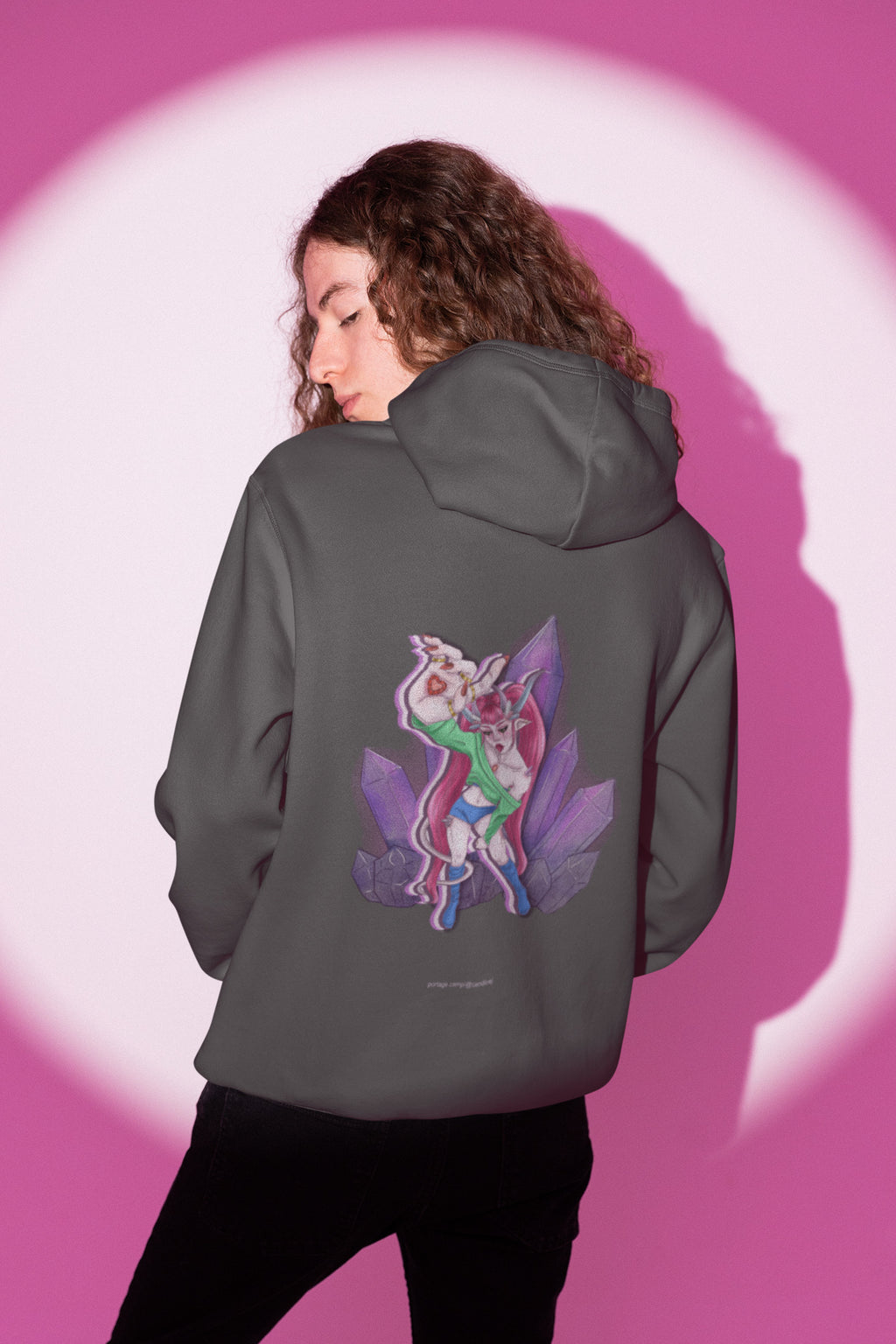 Heart Thief Zip Hoodie in Dark Heather, worn by a man seen from behind in a studio under pink light, showing the large print on the back. Digital product mockup.
