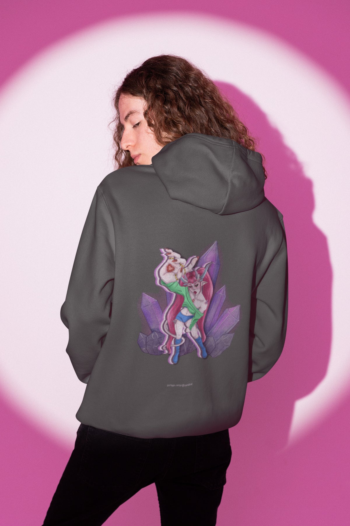 Heart Thief Zip Hoodie in Dark Heather, worn by a man seen from behind in a studio under pink light, showing the large print on the back. Digital product mockup.