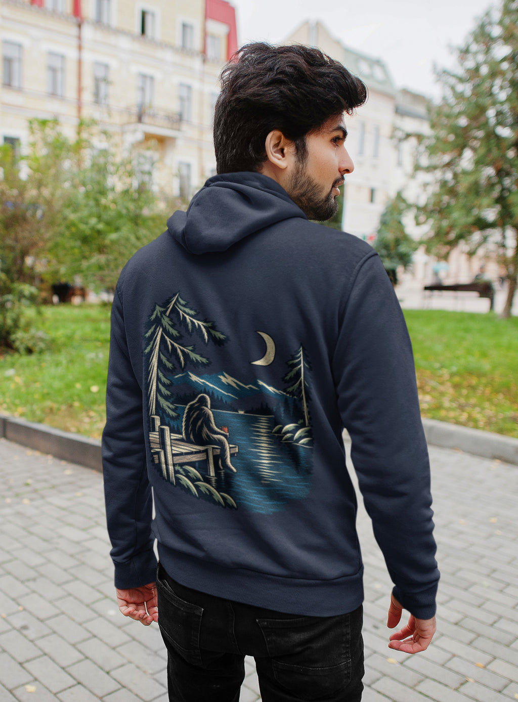 Quiet Hours Zip Hoodie in Navy, worn by a man seen from behind on a quiet city street, showing the large print on the back. Digital product mockup.