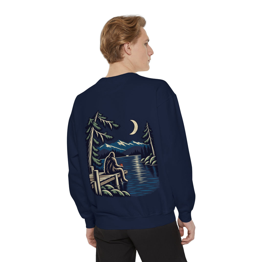 Quiet Hours Garment-Dyed Crewneck in True Navy, worn by a man seen from behind in a plain white studio, showing the large print on the back. Digital product mockup.
