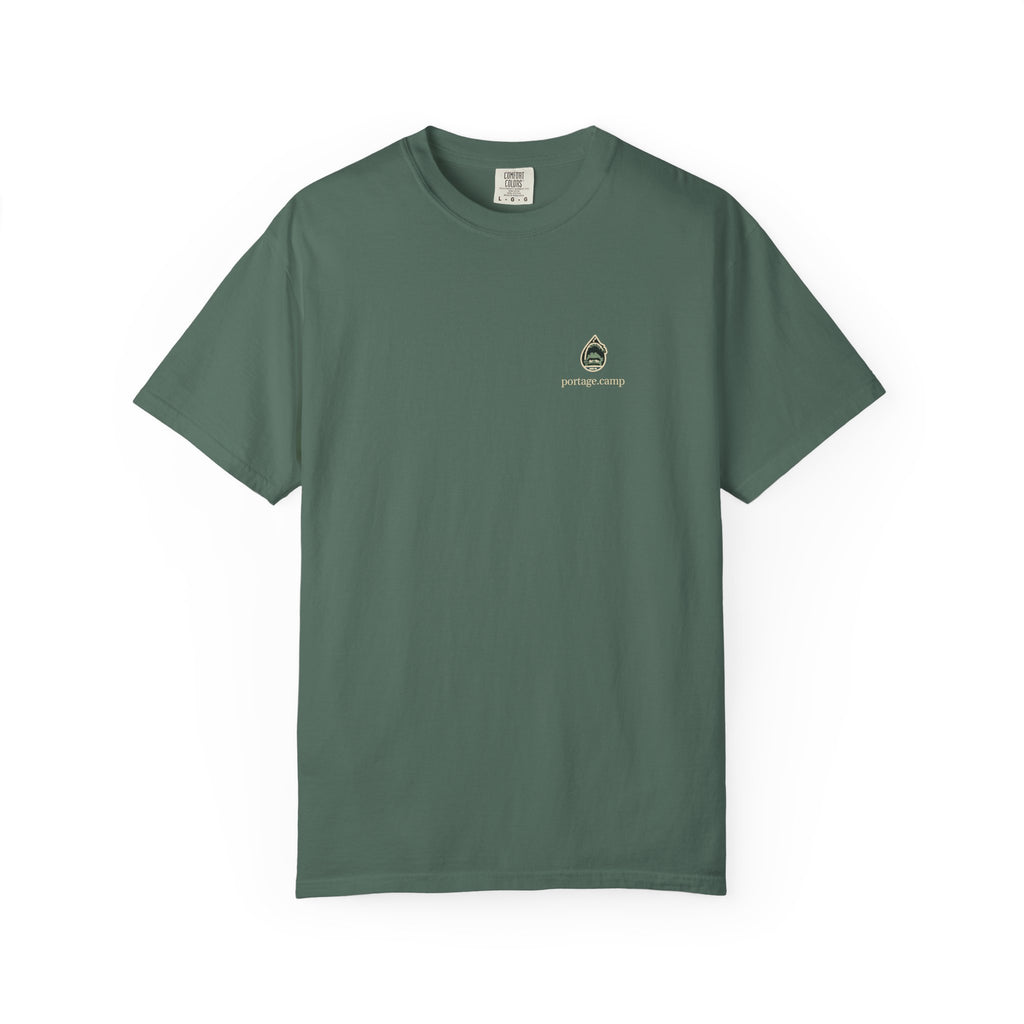 Rain Check Garment-Dyed Tee in Blue Spruce, front view with the Rain Check logo and portage.camp on the chest. Digital product mockup.