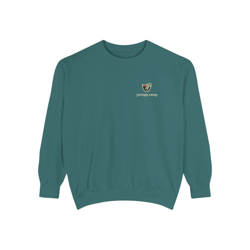 Seen Briefly Garment-Dyed Crewneck in Blue Spruce, front view with the Seen Briefly logo and portage.camp on the chest. Digital product mockup.